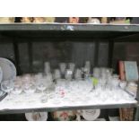 A shelf of drinking glasses