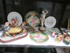 A shelf of miscellaneous plates,