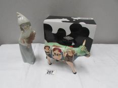 A boxed 'Cow Parade' cow figure and a LLadro figure