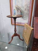 A tripod table and a flat pack one