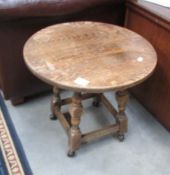 A small circular oak coffee table