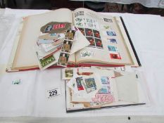 A stamp album (almost empty) and a quantity of loose stamps