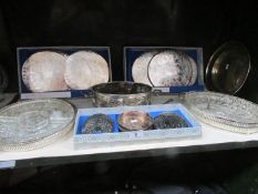 A shelf of silver plate entree' dishes,