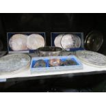 A shelf of silver plate entree' dishes,