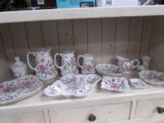 12 pieces of James Kent rose decorated china including set of 3 graduated jugs