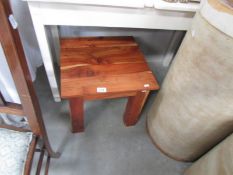 A small rustic coffee table