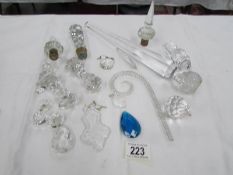 A mixed lot of glass stoppers, knife rests,