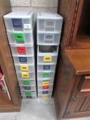A quantity of plastic storage drawers