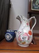 An Adam's blue Jasper ware jug and an a/f floral jug