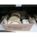 A box of tea and dinner ware