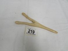 A pair of ivory glove stretchers