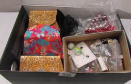 A box of costume jewellery including earrings,