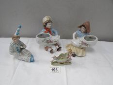 A pair of Dutch children posy holders,