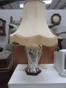 An oriental style table lamp with shade