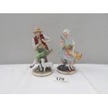 A pair of porcelain figures