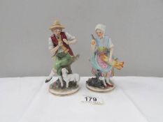 A pair of porcelain figures