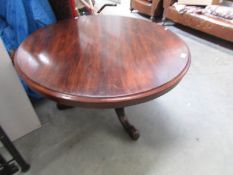 A Victorian mahogany circular cabriole leg table