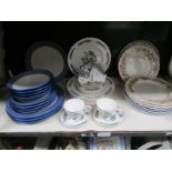 A shelf of assorted dinner ware