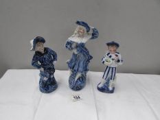 3 blue and white figures