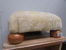 An upholstered foot stool