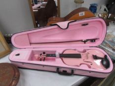 A Hokada guitar and a pink student half size violin by Gear4music with case