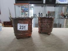 A pair of arts and crafts copper pots