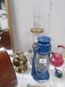 2 oil lamps and a hurricane lamp
