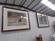 A pair of framed and glazed prints of black labrador's,