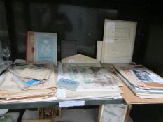 A shelf of ephemera including ration books