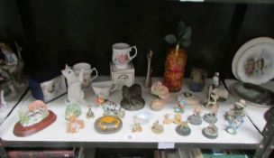 A mixed lot of pottery figurines,