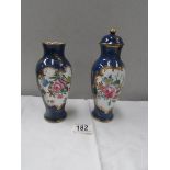 A pair of 'New Chelsea' lidded vases (one a/f and missing lid)