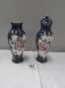 A pair of 'New Chelsea' lidded vases (one a/f and missing lid)