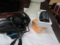 A Canon EOS camera and a lens