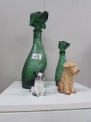 2 green glass decanters in the shape of dogs and 2 dog figures