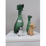 2 green glass decanters in the shape of dogs and 2 dog figures