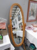 An oval cheval mirror