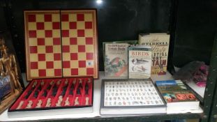 A chess set and a quantity of books