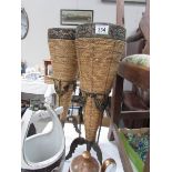 A pair of metal framed vases