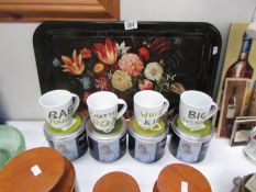 5 Jamie Oliver cheeky mugs in tins and a floral decorated tray