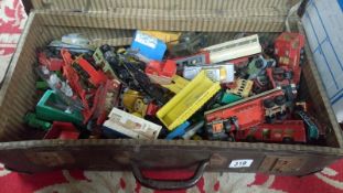 A suitcase of play worn die cast toys,