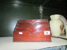 A mahogany letter rack