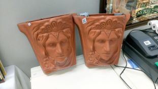A pair of wall planters