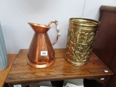 A copper jug and a brass bin