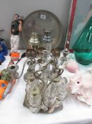 A collection of silver plated ware including cocktail shakers, condiment set, 2 branch candelabra,