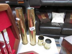 4 brass shell cases