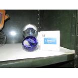 A boxed crystal ball and a Caithness paperweight