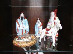 3 oriental figures,