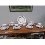 A 21 piece Paragon Michelle pattern tea set