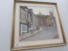 A framed Lincoln street scene signed Richard Riley 1985