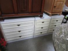 A 3 drawer chest and a pair of matching bedsides